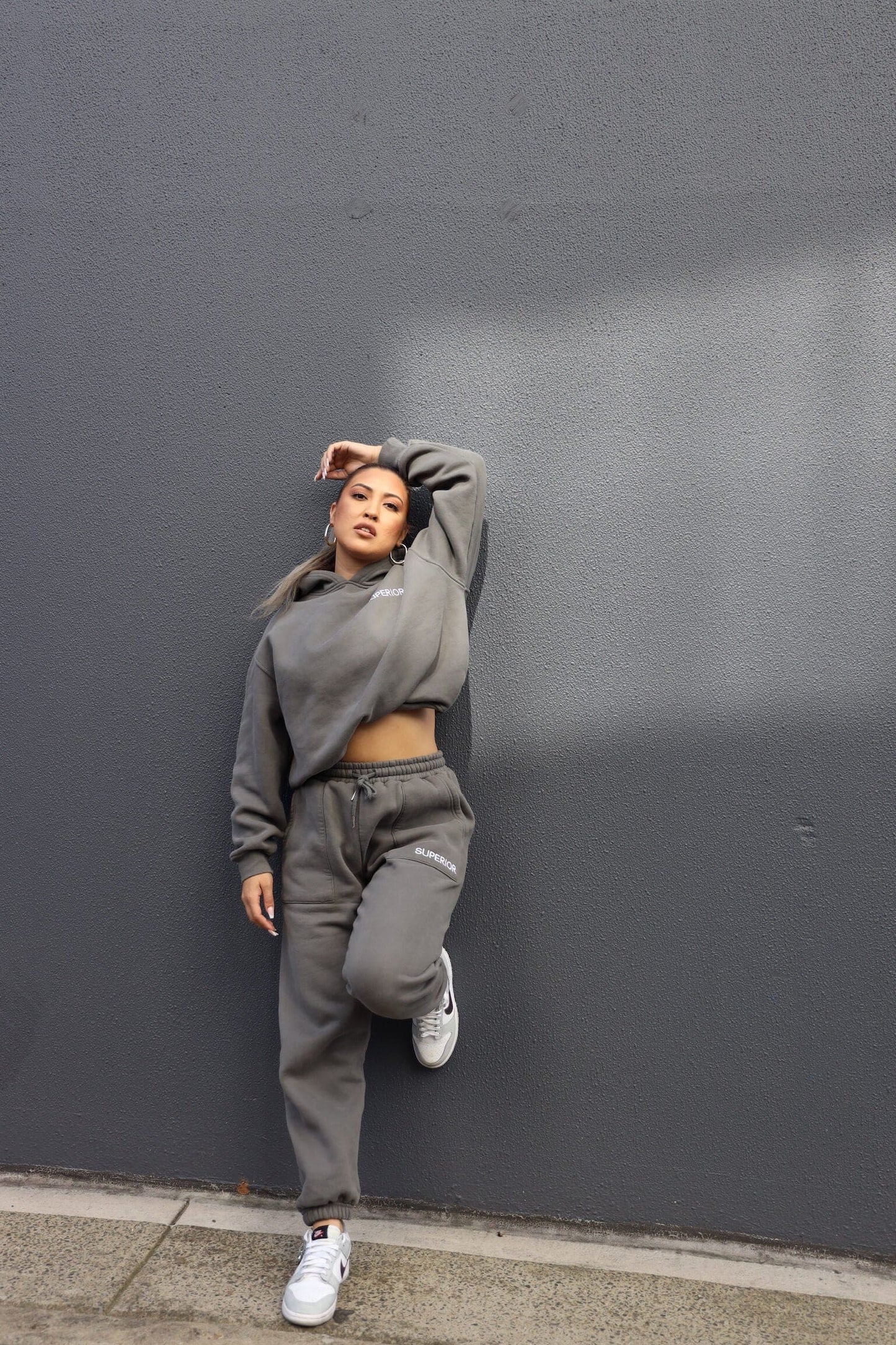 full body pose in full dark grey set